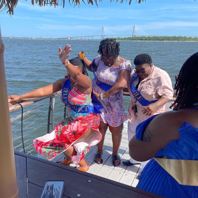 Girls dancing on a bachelorette party on a boat