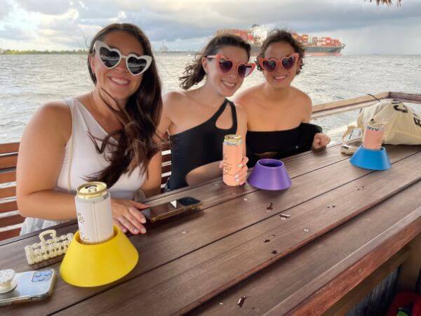 Small group of girls having fun while on a tiki boat tour